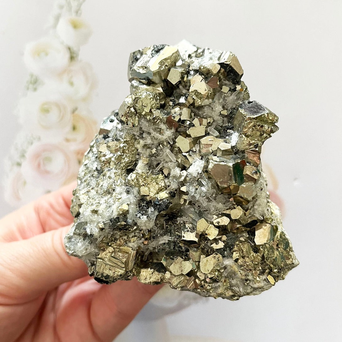 clear quartz cluster with pyrite cubes
