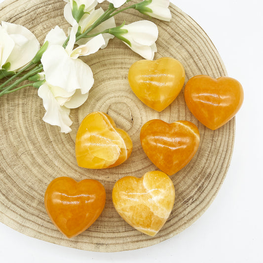 Orange calcite polished heart shaped crystals