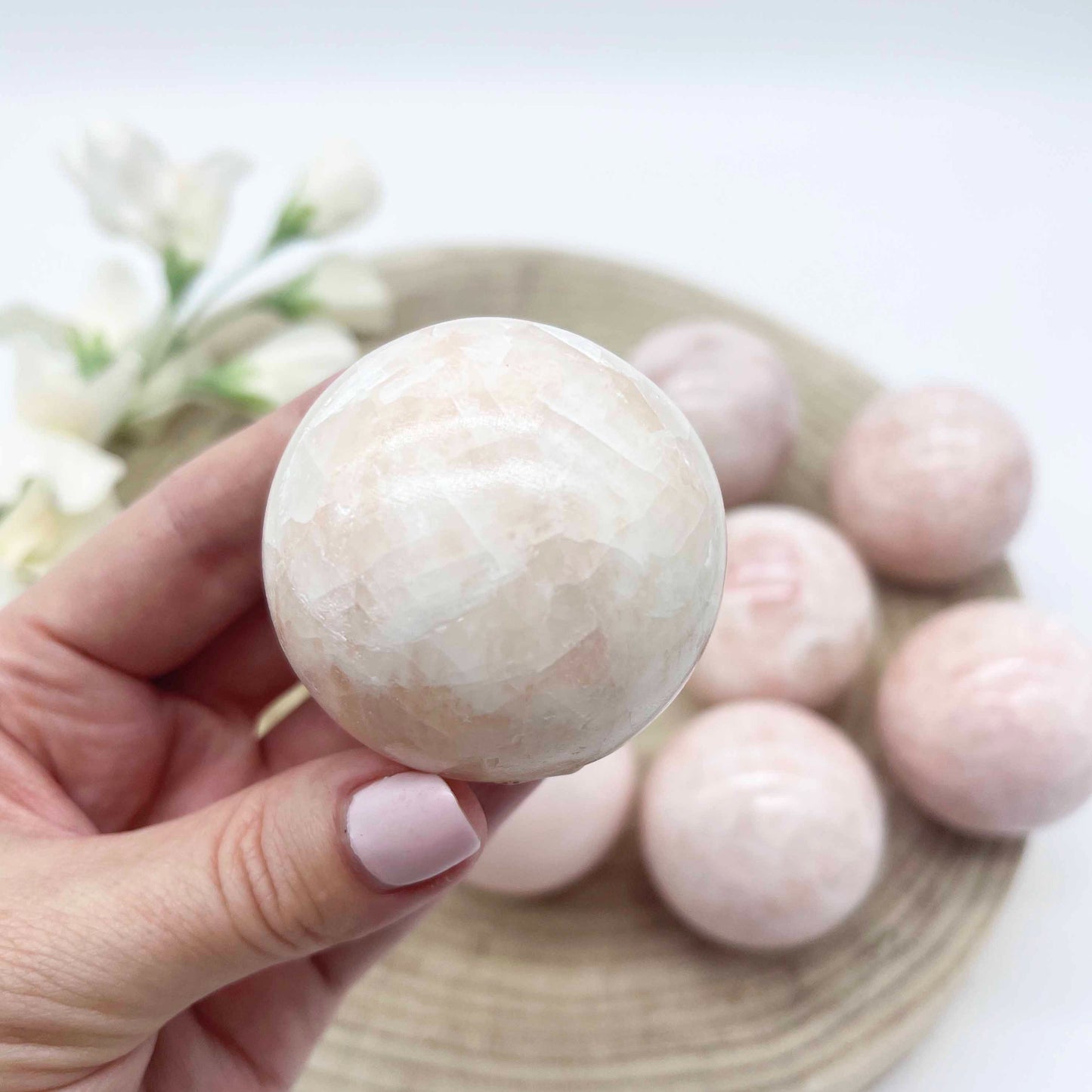 Pink calcite sphere crystal