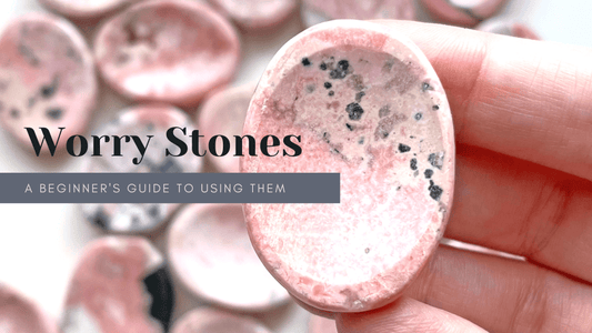 Blog on how to use your crystal worry stone. Rhodonite stone.