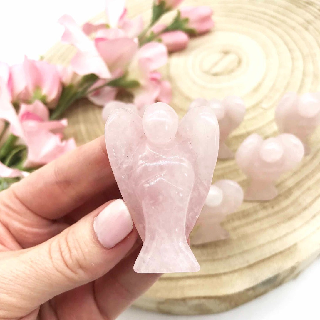 Rose Quartz crystal angel carved polished stone